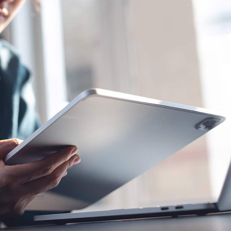 Professional reviewing proxy usage stats and geo-targeted access reports on a tablet